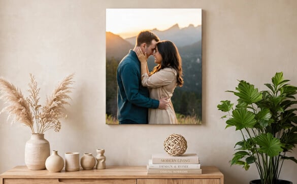 Vertical canvas print of a couple at sunset hanging above a wooden console table